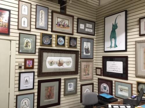 Gallery wall at Canada Goose Gallery in Waynesville Ohio featuring the artwork of P Buckley Moss. 