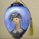 Blue Madonna glass ornament by artist P Buckley Moss features the lovely Madonna in colors of light and dark blue blended colors. Suitable for hanging on the tree or displayed elegantly all year round.