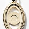 Gold metal surround with center magnet to hold porcelain oval art disks with images by P Buckley Moss. Can be worn on a chain.