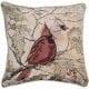 Tapestry pillow with male and female cardinals perched on a branch. Background of holly leave and branches.