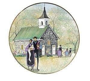 Season of Faith Spring Ornament by P Buckley Moss features a couple with baby in arms in front of a church with colors of cream, cream, gray white and a splash of lavender and black.