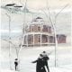 A Snowy Day loft art print by P Buckley Moss features the Loren Andrus Octagon House. Colors of white, and light blues with burgunday brink in the house coupled with black roofs.