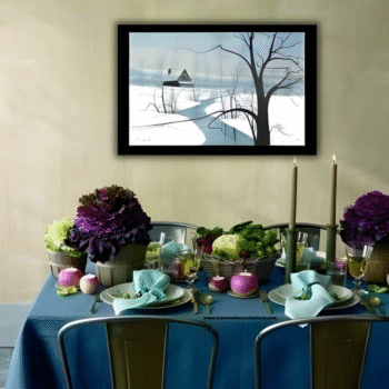 Dining room table styled with blue linens, soft green accents, and Blessed Peace Remarque with Barn artwork on the wall.