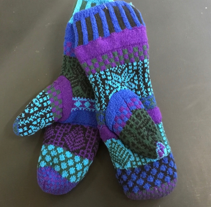Solmate Blue Spruce Mittens feature colors of blues and aqua with a touch of magenta. Solmate Blue Spruce Mittens feature colors of blues and aqua with a touch of magenta.