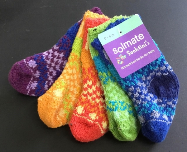 Solmate Prism baby Socks in a rainbow of colors. Five socks to a set and each sock a different melody of colors.