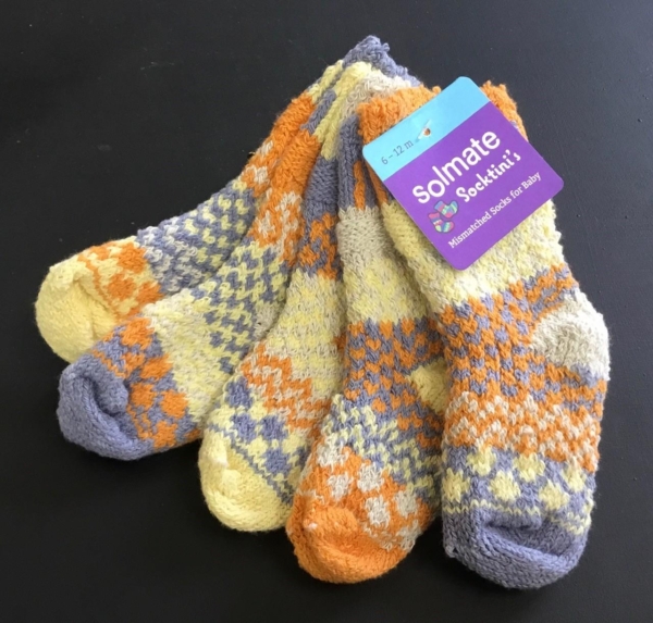 Solmate Puddle Duck baby socks in blue, yellow, cream, and orange.