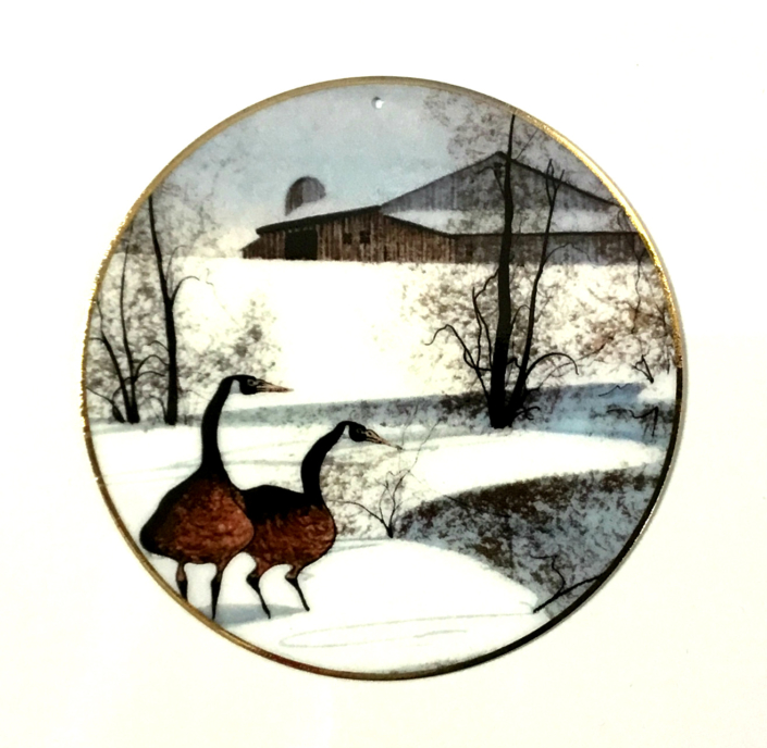 Winter Pond Ornament Winter Pond ornament by P Buckley Moss features two geese by pond with barn in background.