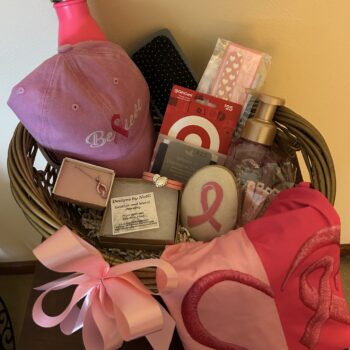 #11 Pink Basket with breast cancer awareness clothing, Believe hat, pink ribbon stone, jewelry, Target gift card, water bottle and accessories.
