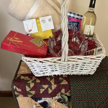 #8 Holiday Basket with Kendra Scott jewelry, handmade quilted table runner, cream Sherpa throw, crystal bowl, Cooper’s Hawk wine, chocolates and gift cards.